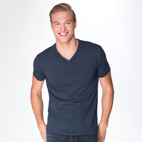 A navy V-neck T-shirt on a smiling male model. The shirt features a logo on the side.