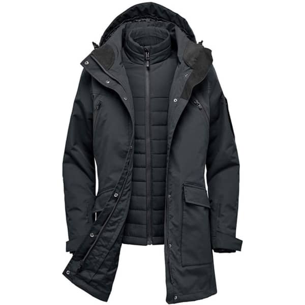 A dark green women's jacket with a removable inner layer and hood, featuring multiple pockets and a branding logo.