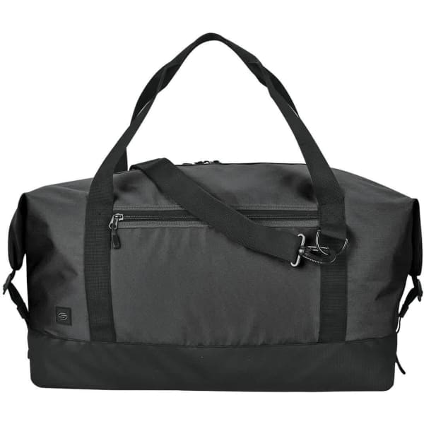 A black duffle bag with dual handles, a detachable shoulder strap, and a zippered front pocket. Features a logo.