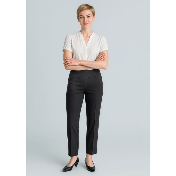Slim leg pants in black on a model, paired with a white top, displaying a sleek, tailored design.