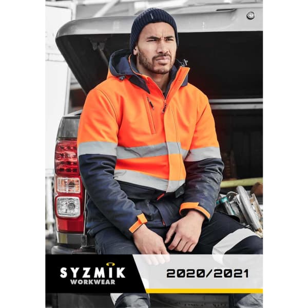 A man in an orange and grey high-visibility jacket sits on a vehicle, wearing workwear attire and a beanie.