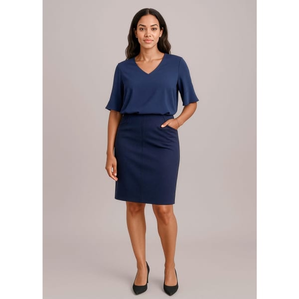 A navy women's pencil skirt with a bandless design and side pockets, paired with a matching top.