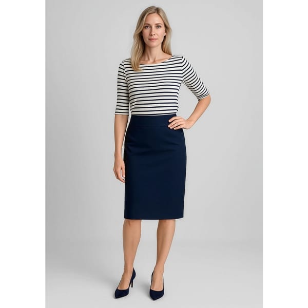 A model wearing a navy lined skirt paired with a striped top, showcasing a relaxed fit and wool stretch fabric.