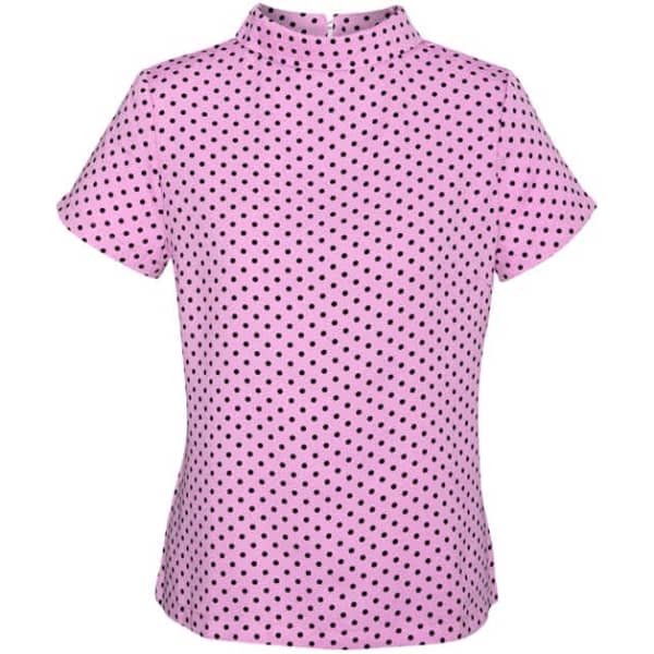 A short sleeve top in pink with black polka dots, featuring a high neck and a logo.