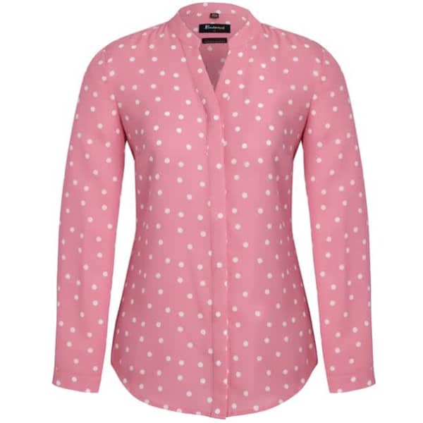 A pink long sleeve blouse with a white spot print and a collar, featuring a small logo.
