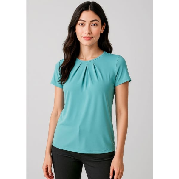 A short-sleeve top in teal with pleated detailing, modelled by a woman against a neutral background.
