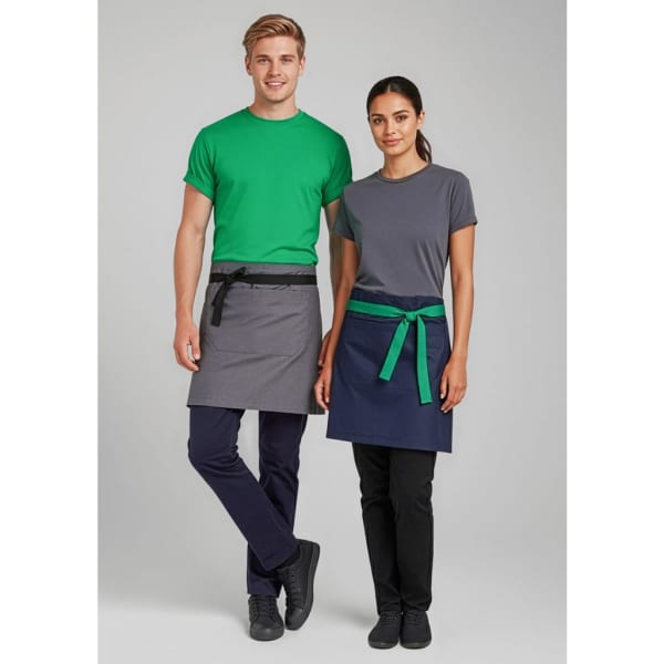 A grey waist apron with a black belt and a navy waist apron with a green belt, worn by two models.