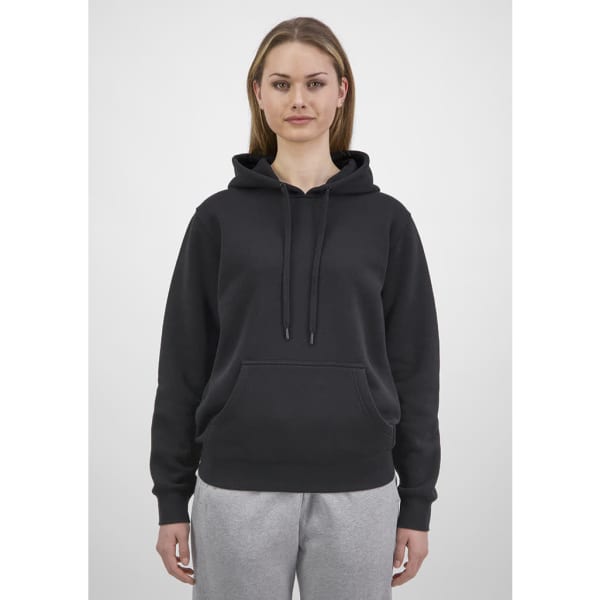 A women's hoodie in black with a drawstring hood and a front pocket, worn with grey pants.