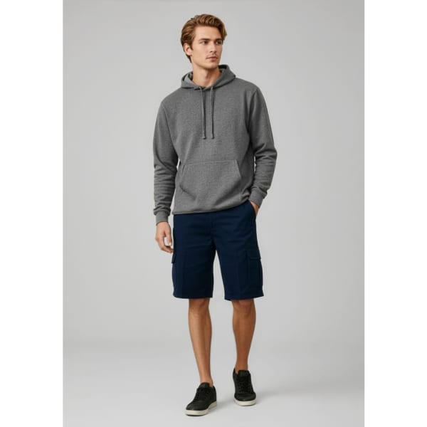 A man wearing a grey hoodie and navy shorts stands casually. The shorts feature pockets and a logo.