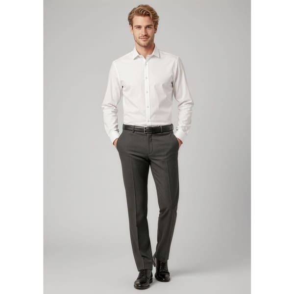 A man is wearing grey classic flat pants paired with a white shirt and black shoes. The outfit has a formal look.