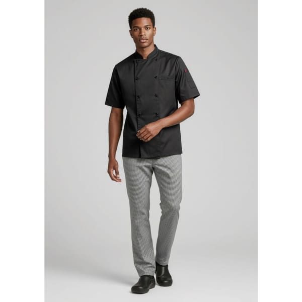 A male model wears a black short-sleeve chef's jacket paired with grey pants, showcasing a stylish uniform look.