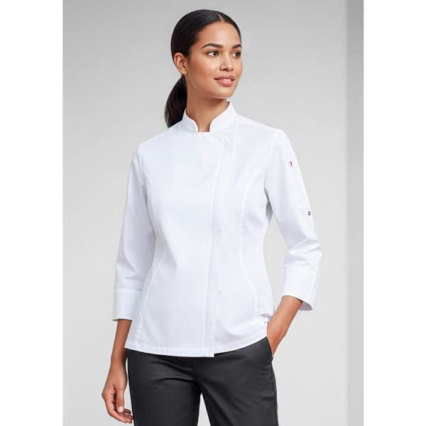 A white long sleeve chef jacket worn by a woman, featuring a stylish collar and a logo on the sleeve.