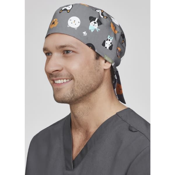 A unisex printed scrub cap in grey featuring various animal patterns, designed for uniform use.