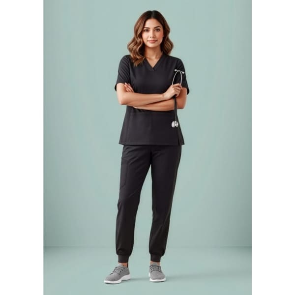 A pair of black slim leg jogger scrub pants, featured on a model with a stethoscope, against a light blue background.