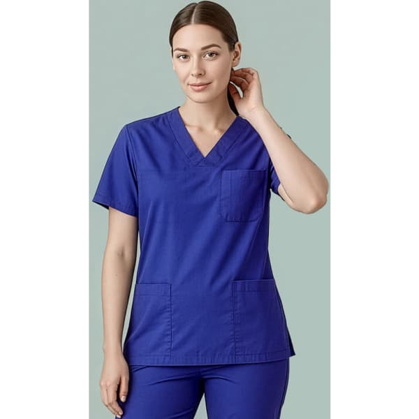 A unisex reversible scrub top in blue, featuring short sleeves and two front pockets. It has a logo on the chest.