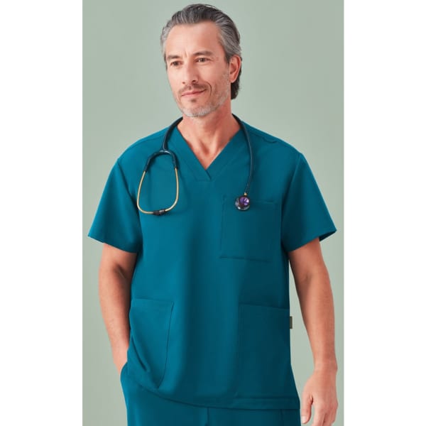 Unisex scrub top in teal with a V-neck, featuring two pockets and a logo. A stethoscope is draped around the model's neck.