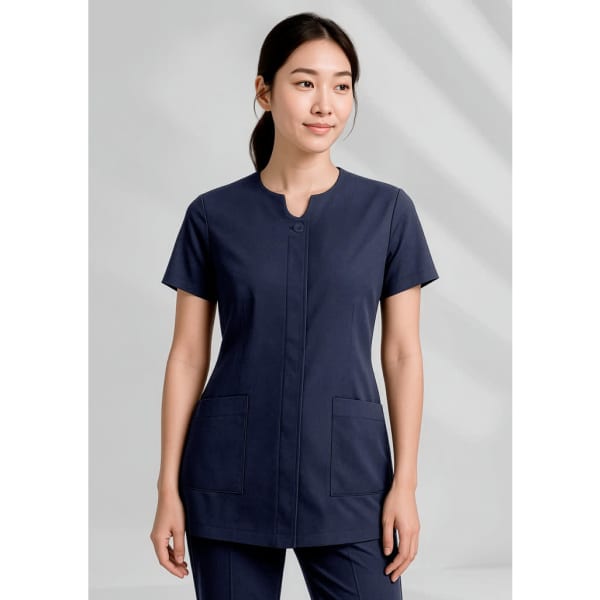 A navy women's tunic with a round neckline and two front pockets, featuring a logo on the chest.