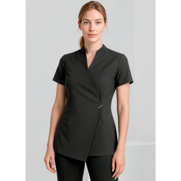 A black women's tunic with a wrap design and a button detail, suitable for spa or uniform wear.