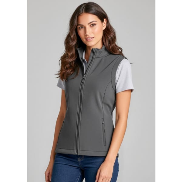 A grey women's vest with a zip front and two side pockets, styled with a short-sleeved shirt underneath.