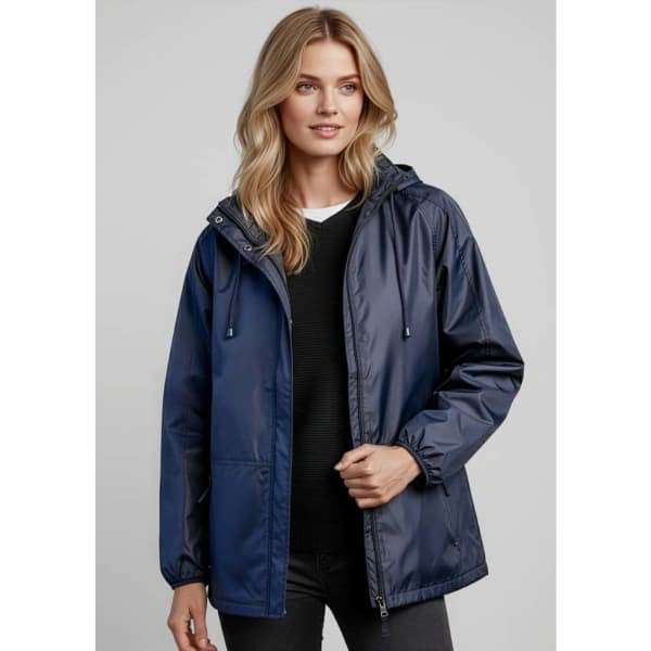 A navy unisex Spinnaker jacket with a hood, featuring a logo. The model is wearing it over a black top.