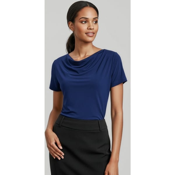 A navy blue women's top with short sleeves and a draped neckline, paired with a black skirt. It features branding.