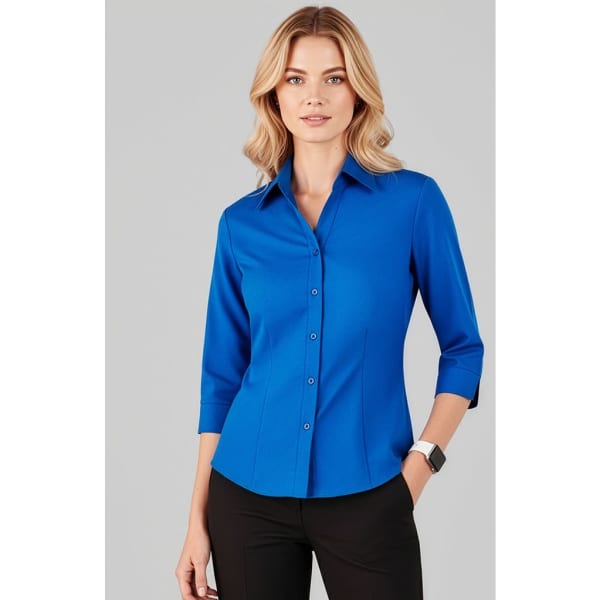 A blue women's button-up shirt with 3/4 sleeves, featuring a collar and a logo.