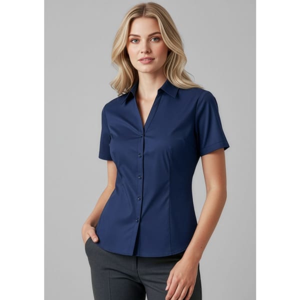 A fitted women's short sleeve button-up shirt in navy blue, featuring a collared neckline and a logo.
