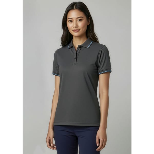 A dark grey women's polo shirt with short sleeves and contrasting collar detailing. The shirt features a logo.
