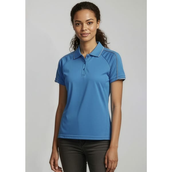 A women's short sleeve polo shirt in a vibrant blue colour, featuring a logo on the chest and side detailing.