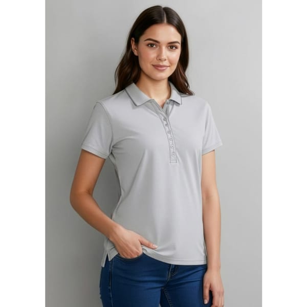 A grey women's short sleeve polo shirt with a button-up collar and side pockets, featuring a logo.