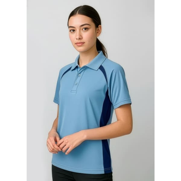 A light blue polo shirt with dark blue side panels, featuring a collar and three buttons. It has a logo on the chest.