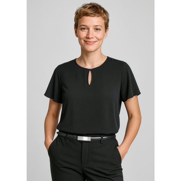 A black short sleeve blouse with a keyhole neckline, paired with tailored trousers. The model smiles while standing.