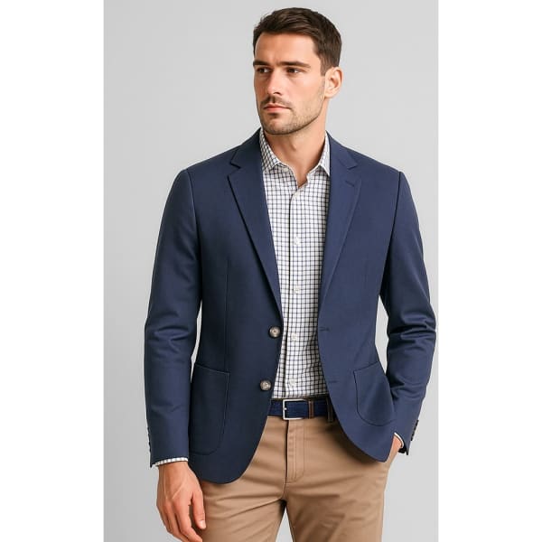 A navy blue men's blazer with two buttons, paired with a checkered shirt and tan trousers. It features a logo.