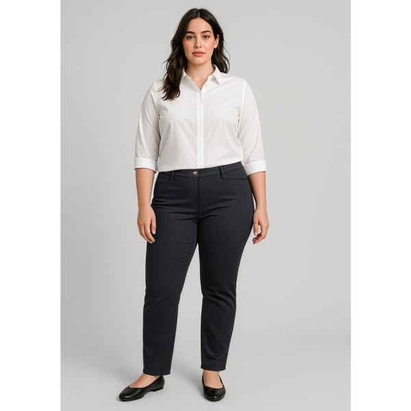 A woman in a white shirt wears navy women's slim leg stretch chino pants, paired with black flats. The image includes branding.
