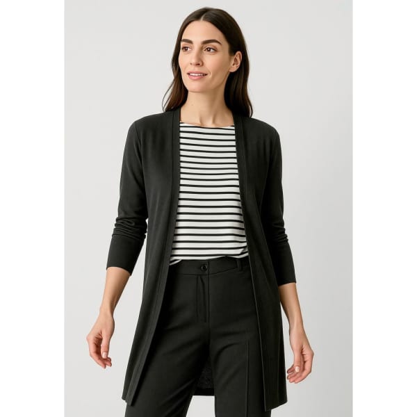 A black longline cardigan with an open front, worn over a striped top and paired with black trousers.