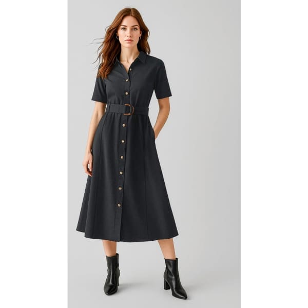 A black midi dress with short sleeves, a button-front design, and a belt at the waist, paired with ankle boots.