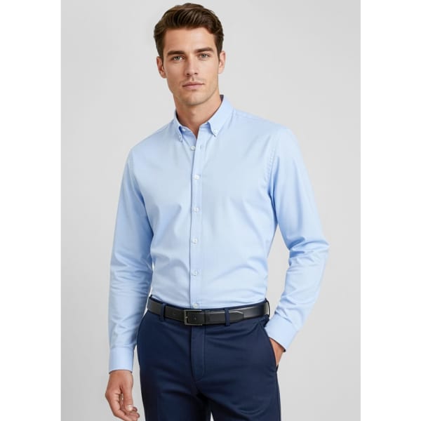 A light blue long sleeve button-up shirt on a model, featuring a collar and tailored fit.