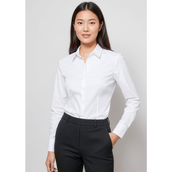 A woman wears a white button-up long sleeve shirt paired with black trousers. The shirt features a collar and has a logo.