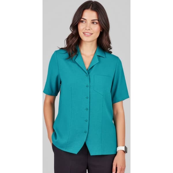 A teal overblouse with short sleeves, featuring a collar and a chest pocket, designed for women's uniforms.