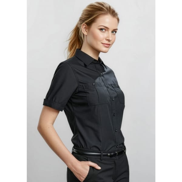 A black button-up short sleeve shirt for women, featuring dual chest pockets and a logo.
