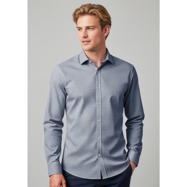 A tailored long sleeve shirt in blue with a subtle pattern, featuring a button-up front and a collar.