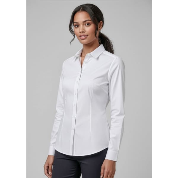 A white button-up long sleeve shirt for women, featuring a collar and a fitted design. The model is standing against a neutral background.