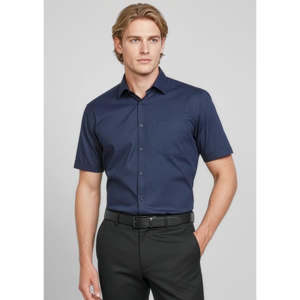 A button-up short sleeve shirt in navy blue, featuring a pocket and a branded logo.