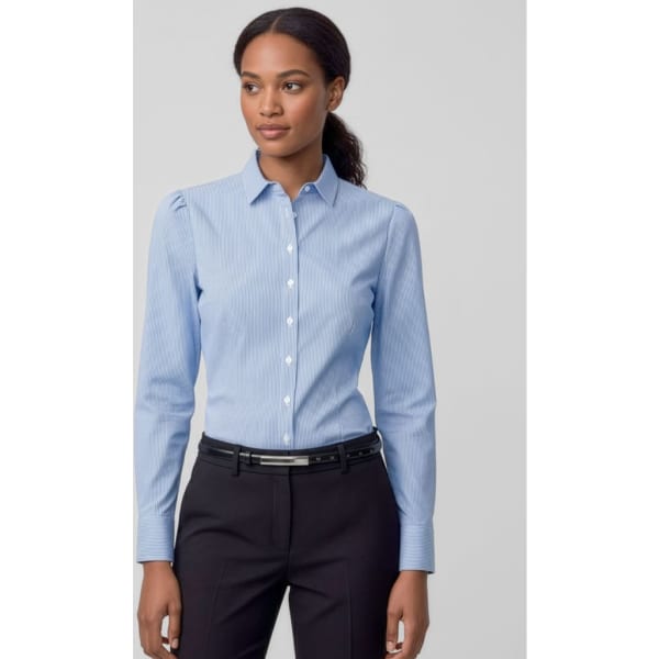A light blue women's long sleeve button-up shirt displayed on a model, featuring a collar and a logo.
