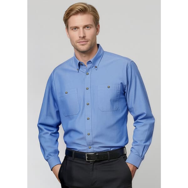 A blue chambray long sleeve shirt with a button-up front and two chest pockets, featuring a logo.