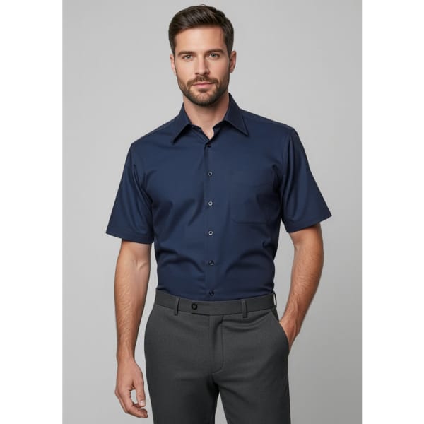 A navy blue men's short sleeve button-up shirt with a collar and a logo on the chest.
