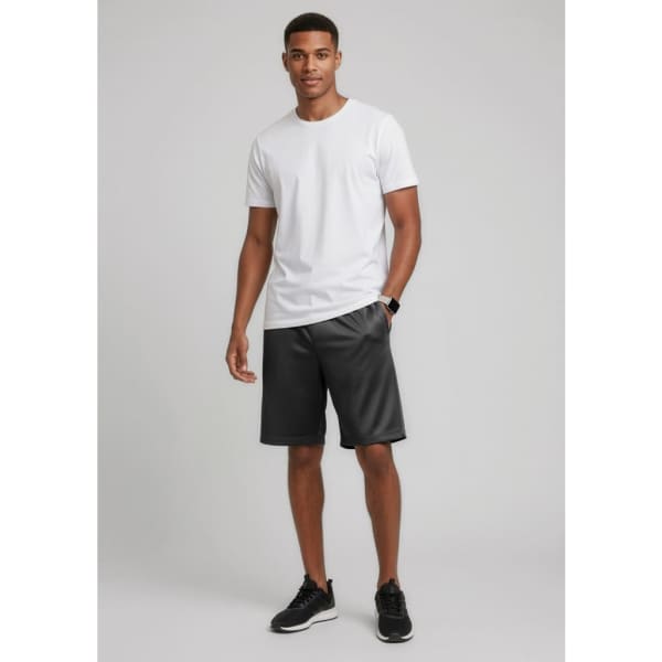 Black sports shorts paired with a white t-shirt, worn by a male model standing against a neutral background.