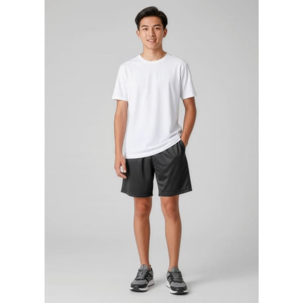 A young male model wearing a white t-shirt and black sports shorts. The shorts have a logo and side pockets.
