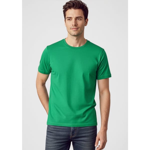 A green short sleeve t-shirt for men, featuring a simple design and a logo. Styled with fitted jeans.