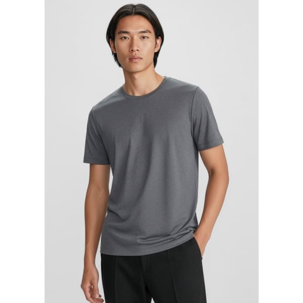 A grey men's short sleeve tee with a round neckline and a logo on the chest. The model has a relaxed pose.